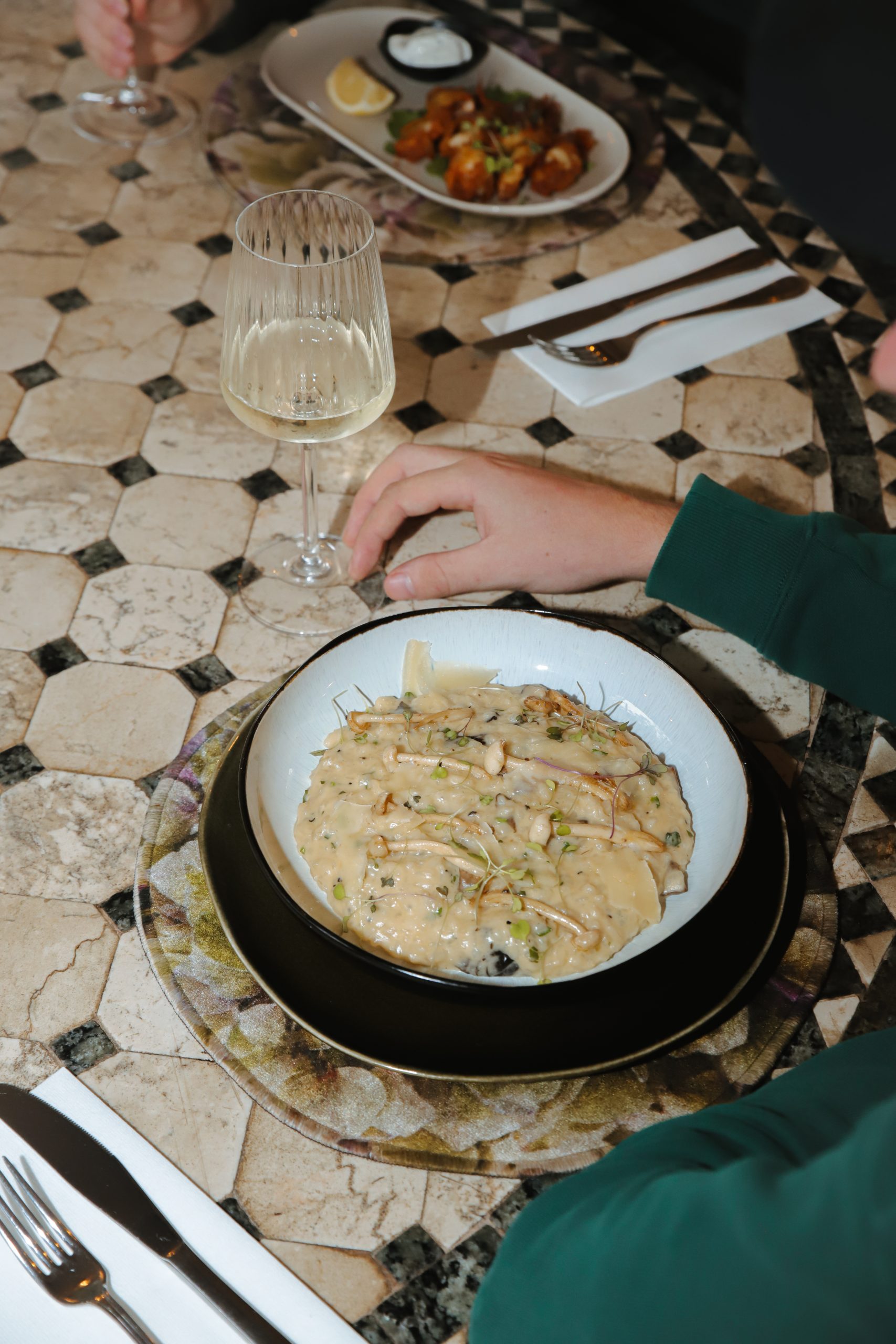 Risotto dish on mosaic table